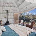 7m King Dome glamping tent internal shot with fireplace and skylight