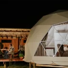 7m King Dome glamping tent external shot at night